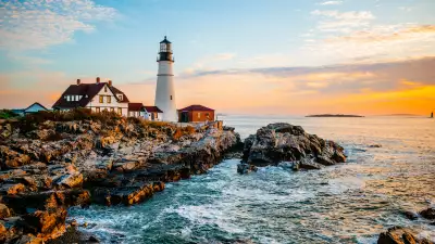 A summer sunrise at one of Maine’s most popular lighthouses, Portland Head Light in Cape Elizabeth