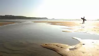 The-Headland-Surfer-Ready-on-Beach