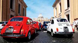 A line of Fiat 500 cars in Rome, Italy