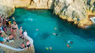 Customers of Rick's Café taking a swim in the sea