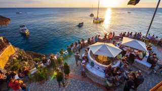 View of the terrace at Rick's Café with the sunset over the Caribbean sea