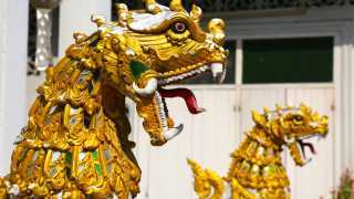 A golden dragon sculpture at a Thai temple
