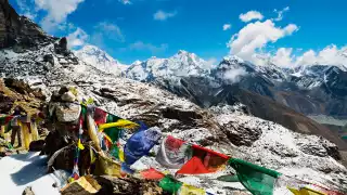 Flags and a view of the Himalayas from Everest