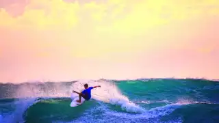 A surfer catching a wave in Rincón