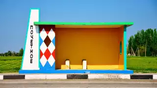 Diamond-patterned Crimean bus stop in blue, red, green and yellow