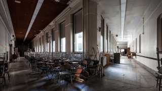 Chairs stacked inside the abandoned Schenley High School, Pittsburgh