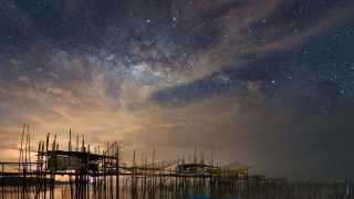 The night sky above a fishing village in Batu Pahat, Malaysia