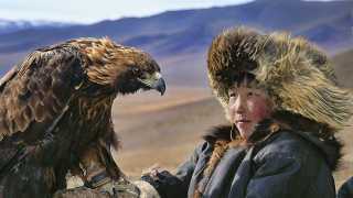 A Mongolian child with a golden eagle