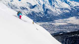 Cross country skiier on the slopes in Innsbruck, Austria