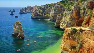 Kayaks and coastline in the Algarve