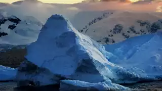 Sunset over an iceberg in Antarctica