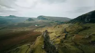 Hiker stood on a stack on the Isle of Skye, UK