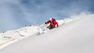 Skiier on the slopes at Kitzbühel