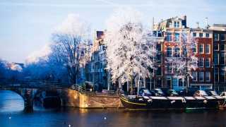 Corner Amstel and Prinsengracht on a cold winter morning. Amsterdam, Netherlands