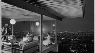 View through a glasshouse over the hills of LA, by Julius Shulman