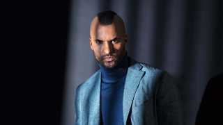 Ricky Whittle, star of American Gods on Amazon Prime, poses in a roll neck