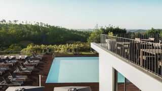 Outdoor pool and terrace at Macdonald Monchique Resort and Spa