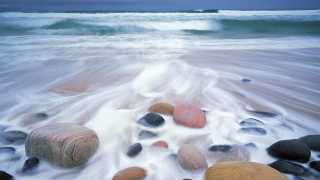 Boulders in the surf at Rackwick Bay, Orkney Islands, Scotland