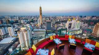 Rooftop bar overlooking the Bangkok skyline in Thailand