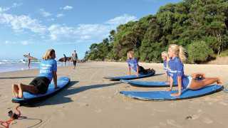 Learning to surf at Byron Bay, NSW