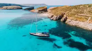Yachting in Blue Lagoon, off the island of Comino