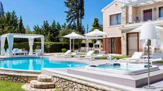 Relax by the pool at Ikos Olivia, Greece