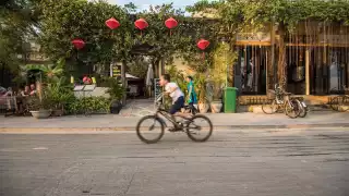 A child cycling in Vietnam