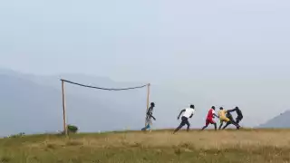 Playing football on the edge of Bwindi Impenetrable Forest, Uganda
