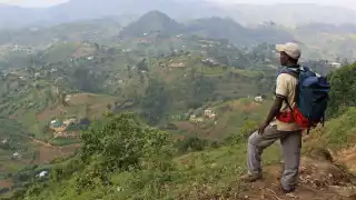 Standing on the edge of the Bwindi Impenetrable Forest in Uganda