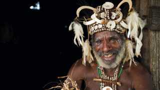 A man in traditional address in the Sepik river region