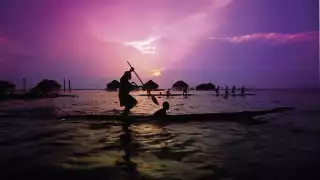 A canoe padler at sunset