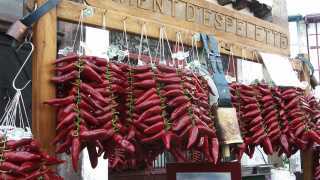 Strings of piment d'Espelette on sale in the French Basque Country