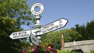 Signpost pointing to Lymington in the New Forest, UK