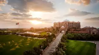 Exterior of Kempinski Emirates Palace in Abu Dhabi, UAE at sunset