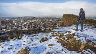 Looking over to the city of Edinburgh from Salisbury Crags in winter