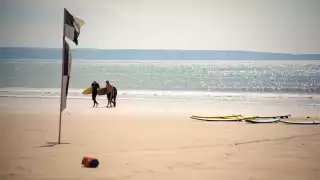 Surfing at Croyde Beach, Devon