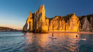 Normandy: Etretat beach with stand up paddleboarders