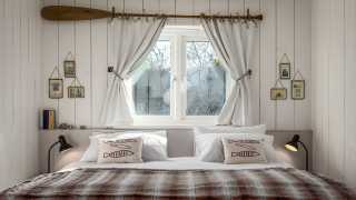 Self-catering accommodation: the bedroom at Lobster Pot, Cornwall