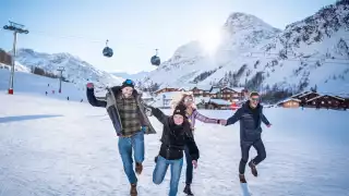 A family on the slopes at Val d'Isère ski resort