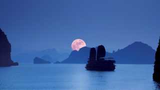 Boat and sunset at Ha Long Bay, Vietnam