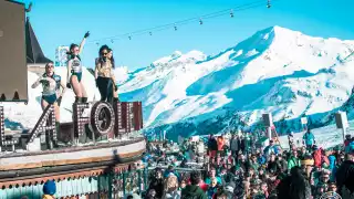 Dancers perform on the roof of La Folie Douce to hundreds of skiers