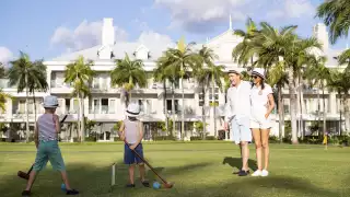 Kids playing croquet