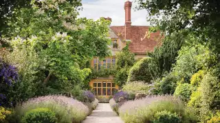 The famous lavender-hemmed entrance to Le Manoir
