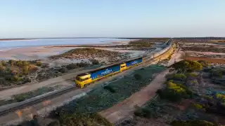The Indian Pacific passing Lake Julia, in Western Australia