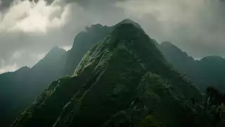 Mount Sabyinyo, whose summit trisects Rwanda, Uganda and the DRC, cuts an intimidating skyline above Mgahinga