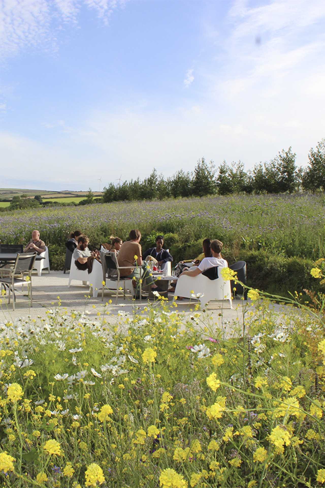 Drinking on the terrace at Trevibban Mill in Cornwall