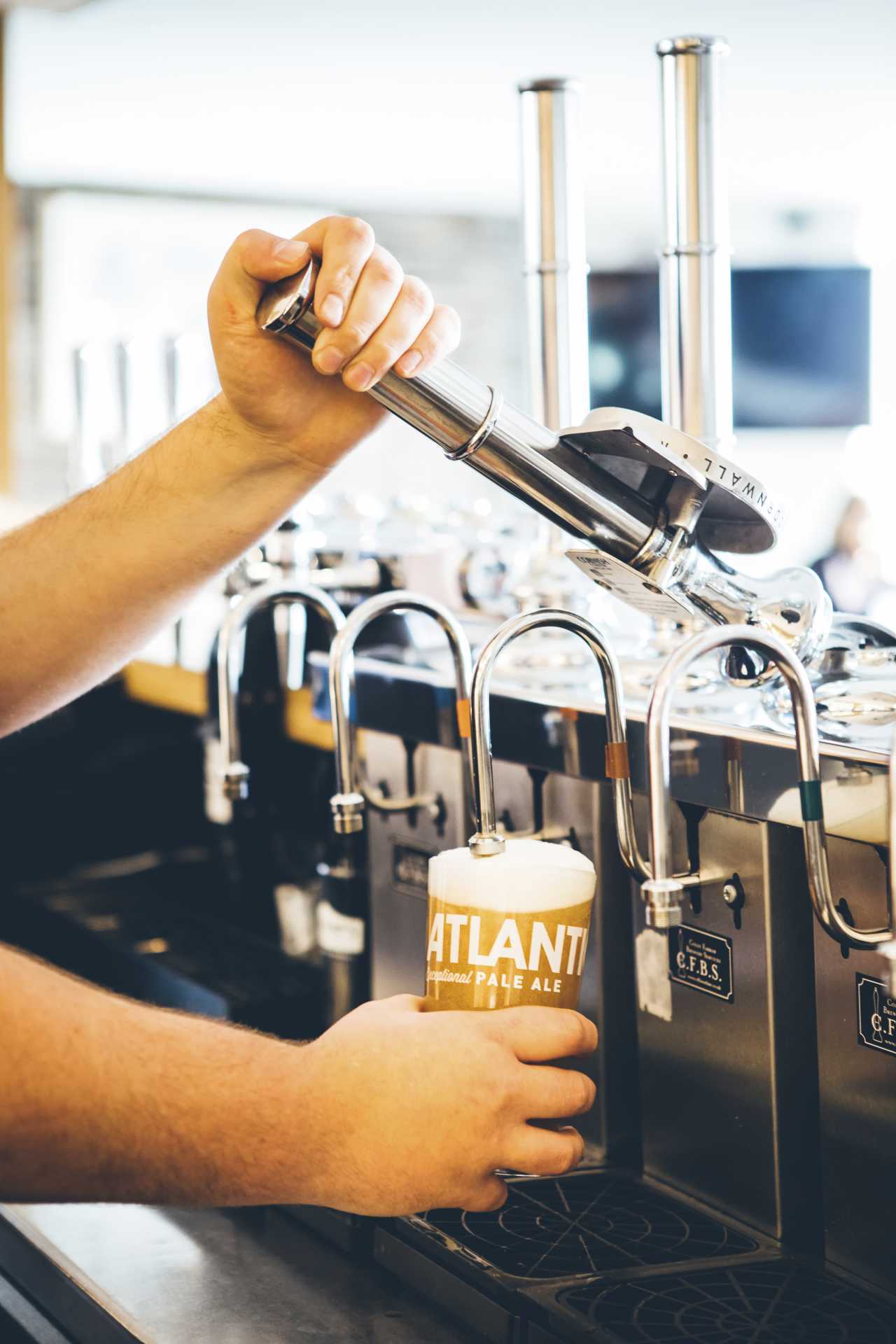 Pulling a pint at Sharps brewery in Cornwall