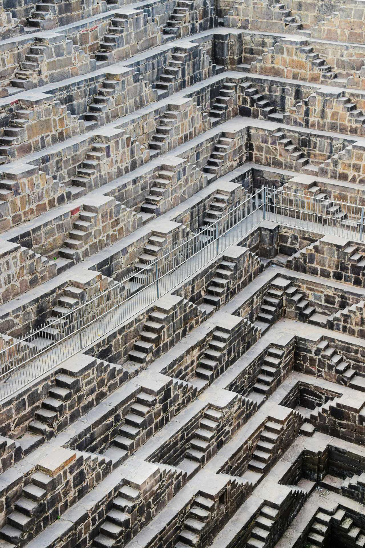 The MC Escher-like walls of the Chand Baori Stepwell in the city of Abhaneri in Rajasthan, India