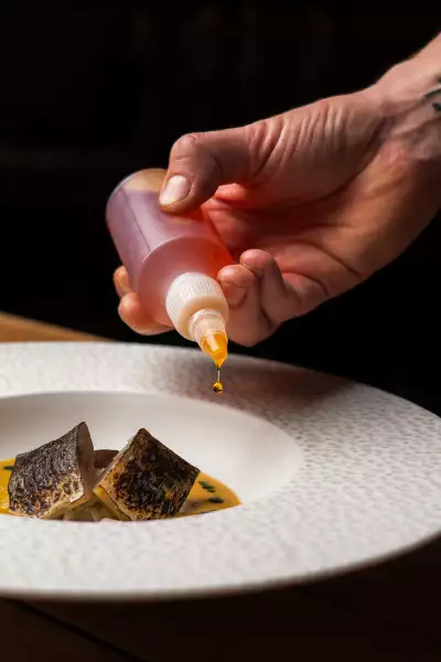 Lightly cured and torched mackerel with fennel salad, spiced fish soup and red pepper rouille
