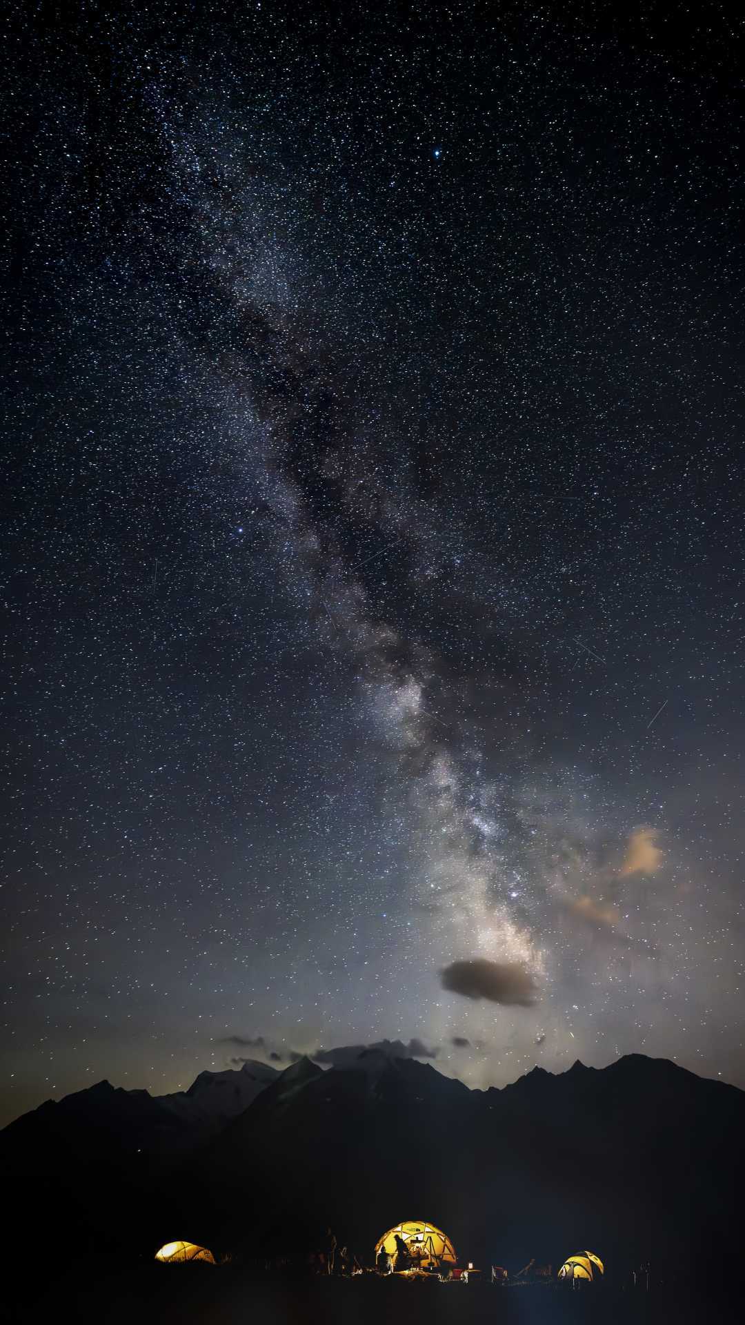 A star-studded sky above the tents captured on a clear night at Basecamp